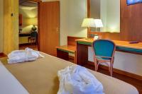 Posteľ alebo postele v izbe v ubytovaní Hotel Raffaello