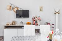 A television and/or entertainment centre at "The Cottage"with sea view, parking & wifi