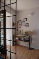 a room with a book shelf and a table at Sun Garda in Ponti Sul Mincio