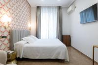 Postel nebo postele na pokoji v ubytování Hostal Oriente