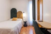 Postel nebo postele na pokoji v ubytování Hostal Oriente