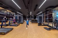 a group of people exercising in a gym at PARKROYAL COLLECTION Marina Bay, Singapore in Singapore