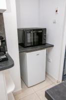 Kuchyň nebo kuchyňský kout v ubytování Paradise Apartment