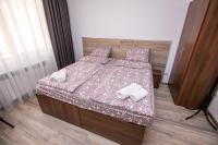 Postel nebo postele na pokoji v ubytování Paradise Apartment