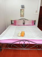 Postel nebo postele na pokoji v ubytování TAMONWAN HOUSE Koh Tao