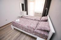 Postel nebo postele na pokoji v ubytování Paradise Apartment