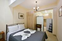 A bed or beds in a room at Sarantis Studio
