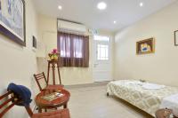 A bed or beds in a room at Sarantis Studio