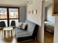 Posteľ alebo postele v izbe v ubytovaní Apartament Przytulny w Krynicy-Zdrój