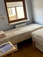 Posteľ alebo postele v izbe v ubytovaní Apartament Przytulny w Krynicy-Zdrój