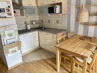 Kuchyňa alebo kuchynka v ubytovaní Apartament Przytulny w Krynicy-Zdrój