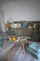 a living room with a couch and a coffee table at appartement carqueiranne le port in Carqueiranne