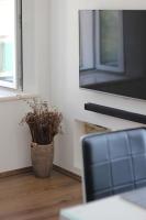 Televízia a/alebo spoločenská miestnosť v ubytovaní Fokus seaview apartment