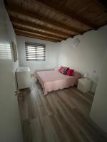 A bed or beds in a room at Avenida central
