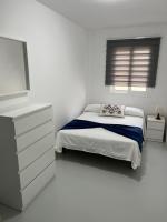 A bed or beds in a room at Avenida central