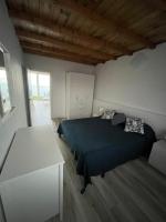 A bed or beds in a room at Avenida central