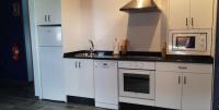 Kuchyň nebo kuchyňský kout v ubytování El Rato Apartamentos Rurales