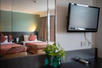 I Pavilion Hotel Phuketにあるベッド