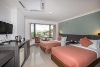 I Pavilion Hotel Phuketにあるベッド