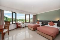 I Pavilion Hotel Phuketにあるベッド
