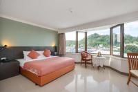 I Pavilion Hotel Phuketにあるベッド