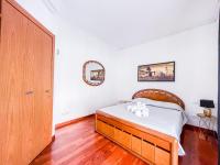 A bed or beds in a room at MYHOUSE INN PORTA NUOVA - Affitti Brevi Italia