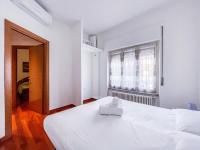 A bed or beds in a room at MYHOUSE INN PORTA NUOVA - Affitti Brevi Italia