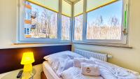 Posteľ alebo postele v izbe v ubytovaní Apartamenty Cicha by Royal Aparts