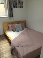 A bed or beds in a room at Dembi at the Great City Park