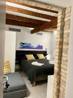 A bed or beds in a room at ALLA QUERCIA - CENTRO STORICO