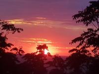 The sunrise or sunset as seen from a vendégházakat or nearby