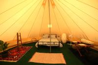 a room with a bed in a tent at Camping Arbre de Vie in Montagnac
