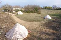 two tents in the middle of a field at Camping Arbre de Vie in Montagnac