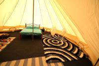 a tent with a zebra rug in a room at Camping Arbre de Vie in Montagnac