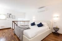 A bed or beds in a room at Campo dè Fiori Detached Apartment Eligio - Top Collection