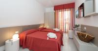 A bed or beds in a room at Zenit Hotel