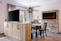 A television and/or entertainment centre at Apartments Pragser Wildsee Winklwiese