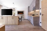 A kitchen or kitchenette at Apartments Pragser Wildsee Winklwiese
