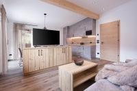 A television and/or entertainment centre at Apartments Pragser Wildsee Winklwiese
