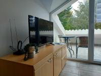 Televízia a/alebo spoločenská miestnosť v ubytovaní Apartment Modrić Zadar