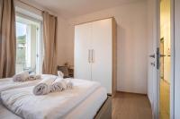 Posteľ alebo postele v izbe v ubytovaní Residence La Villa Tesoro