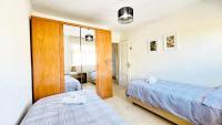 Postel nebo postele na pokoji v ubytování Tropical penthouse