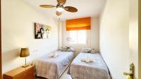 Postel nebo postele na pokoji v ubytování Tropical penthouse