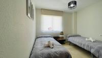 Postel nebo postele na pokoji v ubytování Tropical penthouse