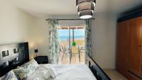 Postel nebo postele na pokoji v ubytování Tropical penthouse