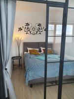 Posteľ alebo postele v izbe v ubytovaní Apartament XAVIER Kościelisko