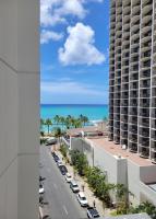 a view of the ocean from the balcony of a building at Hotel Renew in Honolulu