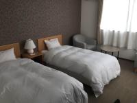 SUN PLAZA HOTEL 富士山中湖にあるベッド