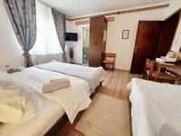 Posteľ alebo postele v izbe v ubytovaní Lazy Bear