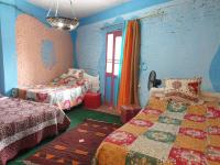 Postel nebo postele na pokoji v ubytování Rural Guest House فندق البيت الريفي